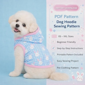 May include: A small white dog wearing a blue and pink dog hoodie with a bunny pattern. The hoodie is part of a PDF sewing pattern, with text that reads "Dog Hoodie Sewing Pattern" and "XS - XXL Sizes".