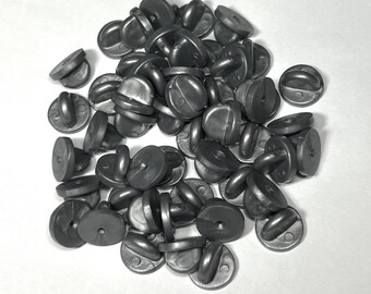 Gray rubber pin backs for lapel, hat pins, badges, and ribbon bars.