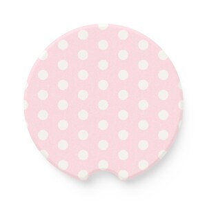 white and pink polka dot car coaster