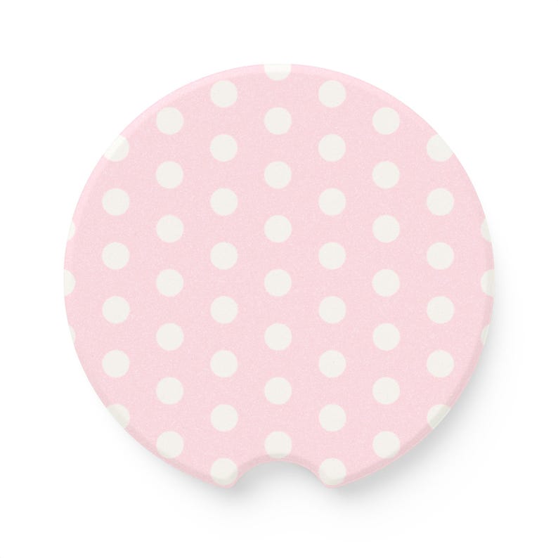 white and pink polka dot car coaster