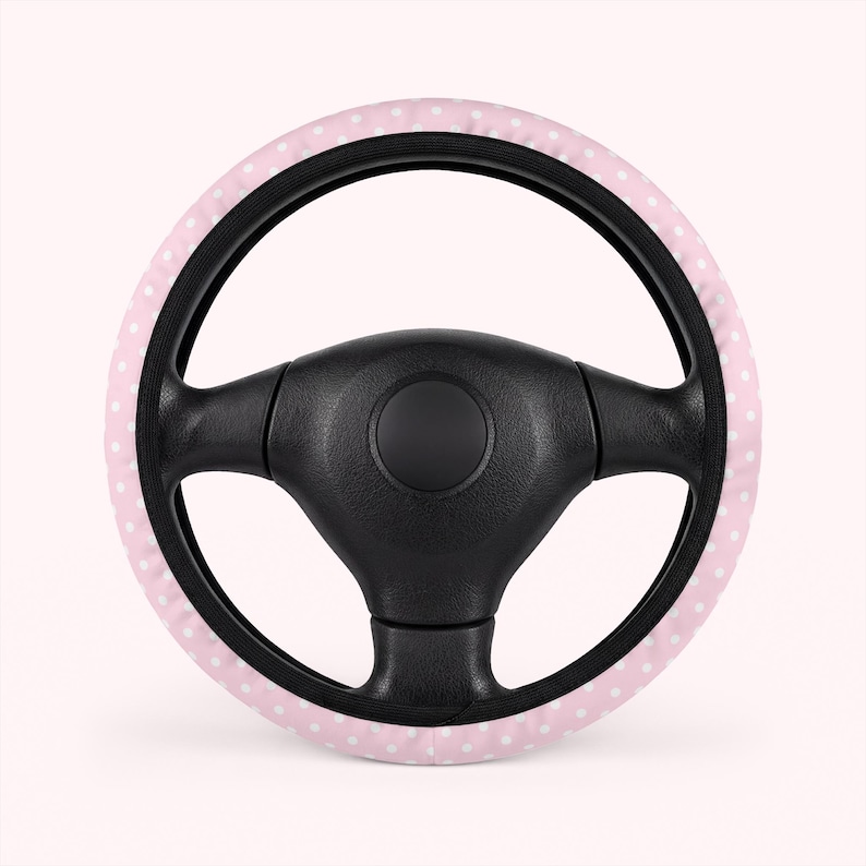 white and pink polka dot steering wheel cover