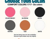 Photo 13 of 17: Six circular color swatches showing Crunchberry, Blossom, Black, Pepper, Yam, and White options for the t-shirt.