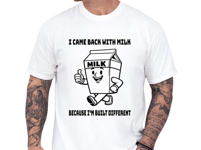 Funny dad shirt with a playful milk carton art graphic and bold Built Different slogan, shown on a white tee for a cool papa outfit or fathers day gift, perfect for a dad joke shirt and family gag clothes with a clean, modern look