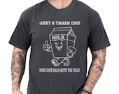 Photo 1 of 8: Funny dad shirt with a playful milk carton art graphic and the phrase Just a Trash Dad Who Came Back With the Milk, a cool papa outfit and fathers day gift idea with a bold retro feel, perfect gag gift shirt for family laughs