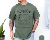 Photo 5 of 8: Vintage t shirt in moss green with a relaxed fit, featuring a witty retro graphic that says Please Be Patient With Me I’m From the 1900s, a funny vintage shirt and gift for him with millennial humor and comfortable tee style