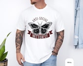 Photo 4 of 8: White unisex funny shirt featuring a bold black butterfly graphic with Anti Social text in a vintage style tee design, a cozy gift for introverts or anyone who loves edgy humor tshirt vibes and minimalist graphic art