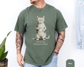 Photo 5 of 8: Funny cat shirt with a grumpy cat holding a mug and the phrase This Is My Tolerance Face on a cozy moss green tee, a dry humor shirt and cat lover gift for him or her with a relaxed vintage feel