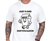 Photo 1 of 8: Funny dad shirt with a playful milk carton art graphic and bold Just a Dad slogan, a witty dad joke tee for a fathers day gift, cool papa outfit, or family gag clothes with a clean, classic look