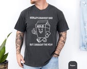 Photo 2 of 8: Funny dad shirt with a playful milk carton art graphic and the phrase World’s Okayest Dad, styled on a cool papa outfit that makes a lighthearted fathers day gift or gift for dad with a casual, cozy, everyday look