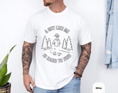 Photo 4 of 8: Bearded hiker wearing a charcoal Comfort Colors sarcastic tee that reads "A guy like me is hard to find" with a whimsical invisible man illustration, cozy soft cotton drape and vintage look, a cheeky dad joke tee and funny meme shirt perfect as a playful gift for husband, dad, or friend
