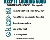 Photo 18 of 20: Care guide graphic for the Gildan 18500 hoodie featuring standard laundry symbols for washing, bleaching, drying, ironing, and dry cleaning.