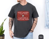 Photo 2 of 8: Casual moss Comfort Colors shirt with a distressed retro play button graphic that reads "Don't worry I got this I watched a YouTube video", soft cotton tee styled on a tattooed dad, playful meme tshirt perfect as a funny dad shirt or fathers day gift for him