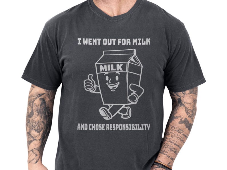 Funny dad shirt on a black tee featuring a playful milk carton art character with the joke I went out for milk and chose responsibility, a clever fathers day gift or gift for dad with cool papa outfit and family gag clothes appeal