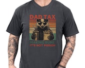 Photo 1 of 8: Soft garment dyed charcoal tee with a vintage badger cartoon in sunglasses holding fries and a drink against retro orange and green stripes, playful dad tax shirt and badger dad tee for a funny dad life tee, casual novelty father's day gift with dad humor