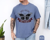 Photo 6 of 8: anti social tshirt with vintage style tee vibes, featuring a bold black butterfly graphic and rustic ribbon text on a soft blue unisex funny shirt, perfect gift for introverts who love edgy humor and cozy casual style