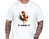 Photo 1 of 8: Black Comfort Colors graphic tee showing a colorful, startled rooster flipping the middle finger with bold "F-CAW-F" text, playful adult humor and edgy protest shirt energy on a relaxed, cozy statement tee, casual streetwear vibe, funny t shirt and gift for him or gift for dad and men's gift ideas