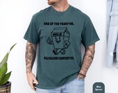 Photo 4 of 8: Funny dad shirt on a laid-back teal tee with a playful milk carton art graphic and “Dad of the Year” joke, perfect fathers day gift or gift for him with cool papa outfit style and a clever snack quest design vibe