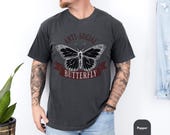 Photo 2 of 8: Vintage style tee with a bold butterfly graphic and anti social humor, shown on a relaxed model for a cool unisex funny shirt look that feels perfect as a gift for introverts or anyone who loves edgy humor and quiet confidence
