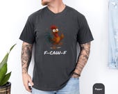 Photo 2 of 8: Moss green Comfort Colors graphic tee with a comical rooster flipping the middle finger and F-CAW-F lettering, a funny t shirt and edgy shirt for casual streetwear, cozy vintage feel, perfect adult humor gift for him or dad