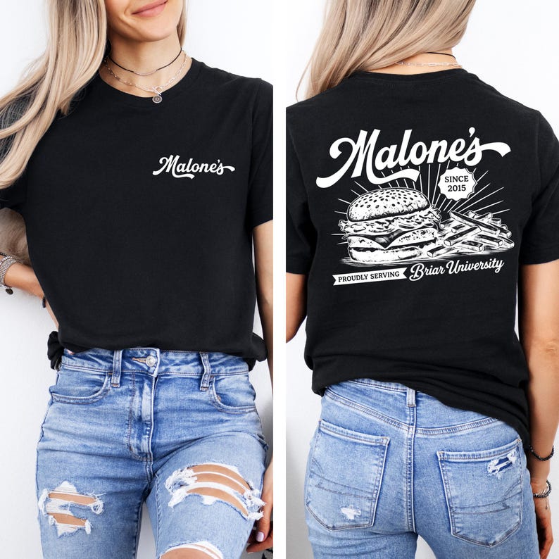 May include: Black t-shirt with the white text "Malone's" on the front and a burger and fries graphic on the back. The back of the shirt also includes the text "SINCE 2015" and "PROUDLY SERVING Briar University".