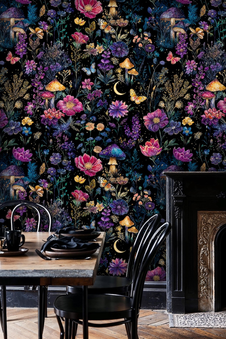May include: A colourful floral wallpaper design with a dark background, showcasing flowers, mushrooms, butterflies, and a crescent moon. The colour scheme includes pink, purple, blue, and yellow. The wallpaper is used as a backdrop for a dining table and chairs.