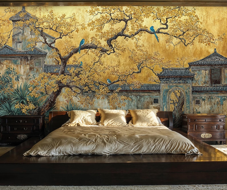 May include: A bedroom featuring a large, dark wood bed frame with a gold-colored comforter and pillows. The wall behind the bed is a mural depicting an Asian-inspired landscape with buildings, trees, and blue birds.
