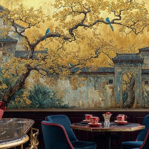 May include: A detailed mural depicting an Asian garden scene with a golden yellow background. The mural features a tree with yellow leaves, blue birds, and traditional architecture. The scene is complemented by a table setting with red cups and blue velvet chairs.