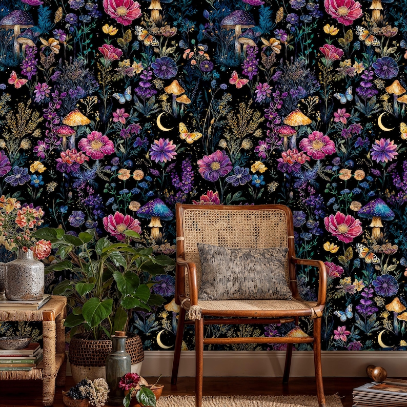 May include: A colourful wallpaper design with a dark backdrop, showcasing flowers, mushrooms, butterflies, and crescent moons. The image includes a wooden chair with a woven back and a decorative cushion, plus potted plants and vases.