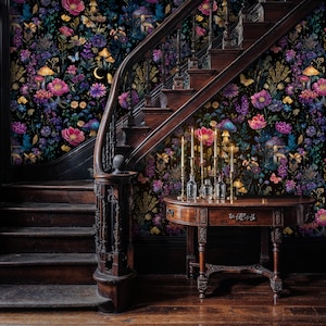 May include: An interior with a wooden staircase and a small table. The walls are adorned with floral wallpaper in shades of pink, purple, and yellow, with mushroom and butterfly motifs. Candles are lit on the table, creating a warm ambiance.