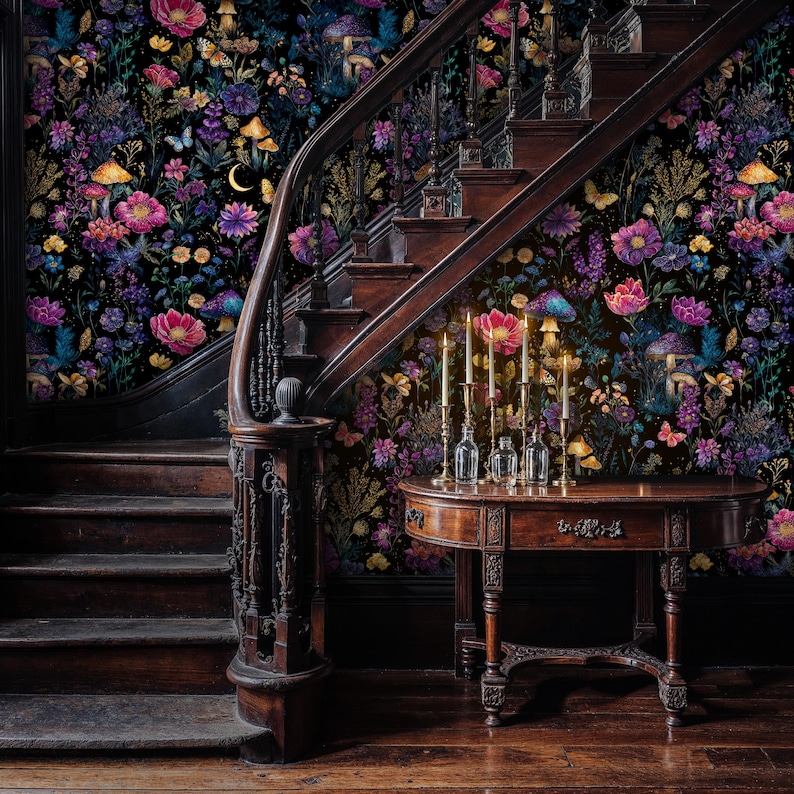 May include: An interior with a wooden staircase and a small table. The walls are adorned with floral wallpaper in shades of pink, purple, and yellow, with mushroom and butterfly motifs. Candles are lit on the table, creating a warm ambiance.