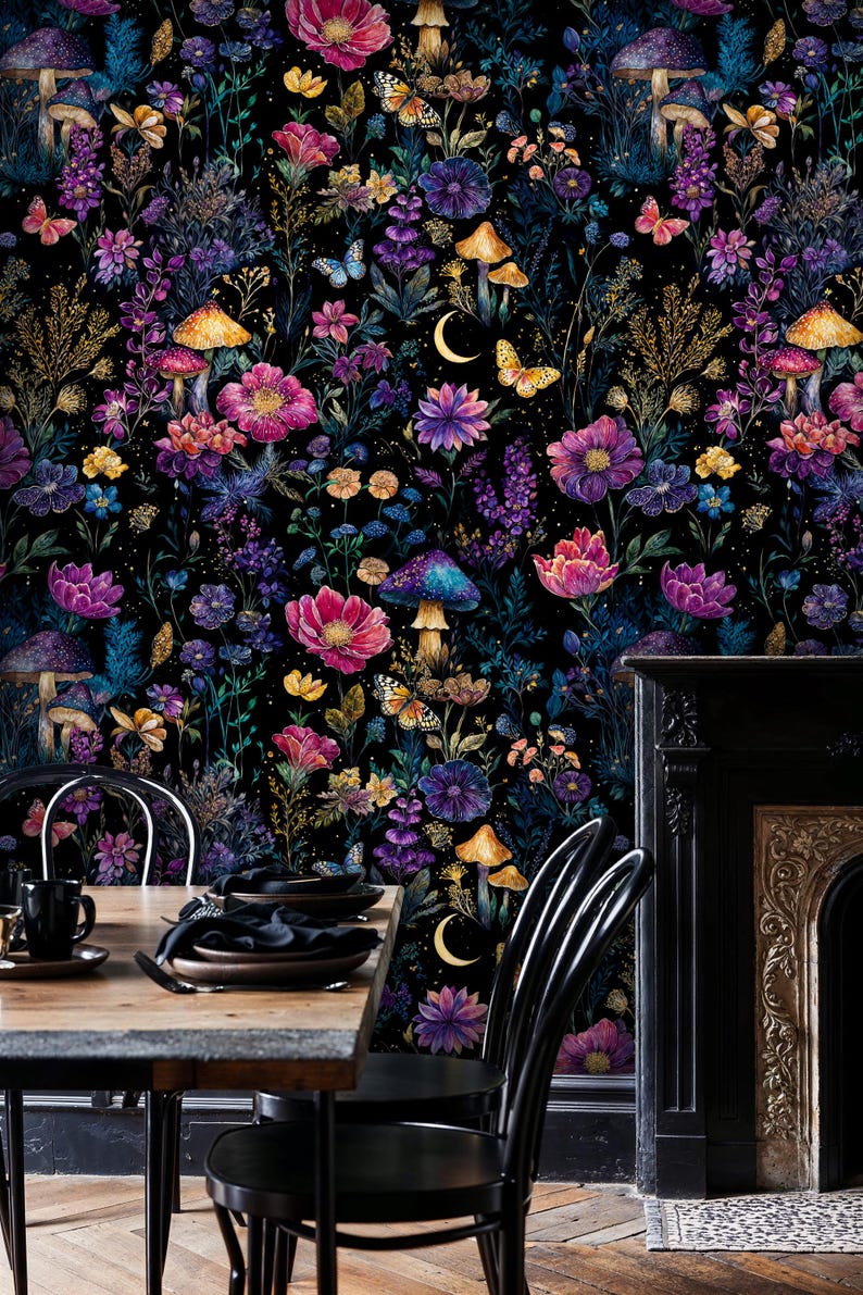May include: A colourful floral wallpaper design with a dark background, showcasing flowers, mushrooms, butterflies, and a crescent moon. The colour scheme includes pink, purple, blue, and yellow. The wallpaper is used as a backdrop for a dining table and chairs.