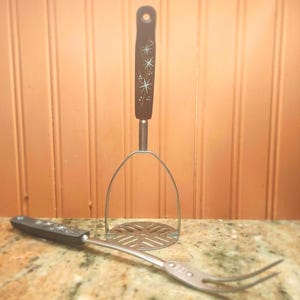 VINTAGE/MCM ECKO stainless steel potato masher and meat fork.