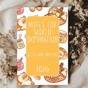 May include: A notebook with a yellow cover featuring the text "NOTES FOR WORLD DOMINATION" and the year "2026". The notebook is decorated with cartoon illustrations of food items and cute characters. The names "Lizzy and Artemis" are also printed on the cover.