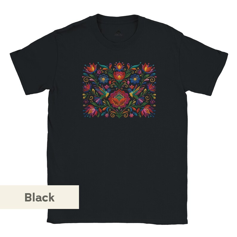 May include: A black short-sleeve t-shirt featuring a central graphic print of colorful hummingbirds surrounded by vibrant red, blue, orange, and green floral patterns and swirling vine motifs arranged in a symmetrical, dense botanical composition.