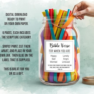May include: A glass jar filled with colourful paper strips. A label on the jar reads "Bible Verse for When You Are." The jar is open, and a hand is reaching in to take a strip. The text on the jar also says "Happy, Sad, Lonely, Angry, Worried, Unloved."