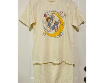 Conjunto deportivo vintage Brazos Sportswear Angel Moon, camiseta y falda color crema, talla única.