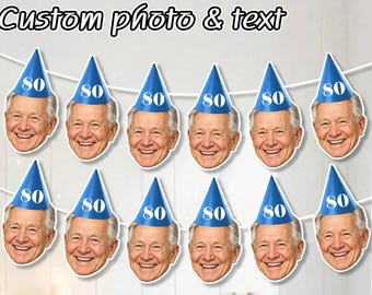 May include: A decorative banner featuring twelve identical cutouts of an older man's smiling face, each wearing a blue party hat with the number 80 printed in white. The text Custom photo & text is displayed at the top of the image.