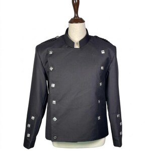 May include: A black jacket with a mandarin collar and long sleeves. The jacket has square silver-coloured buttons and embellishments on the shoulders and cuffs. The jacket is displayed on a mannequin.