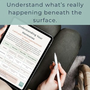 May include: A tablet displaying a guide titled "Understanding Your Hormones" with information on hormones, their functions, and related symptoms. The tablet is held by a person, with a stylus in hand. The text at the top says "Understand what's really happening beneath the surface."