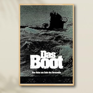 May include: A framed poster for the German film "Das Boot." The image shows a submarine at sea, battling waves. The film's title, in bold white letters, is prominent. The poster has a dark, dramatic aesthetic.