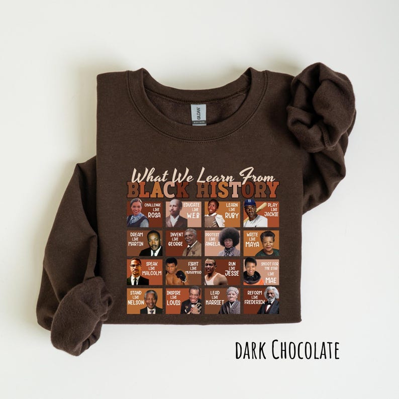May include: Dark chocolate-colored sweatshirt featuring the text "What We Learn From Black History" above a grid of historical figures. The sweatshirt has a crew neck and long sleeves. The words "Dark Chocolate" are printed at the bottom.