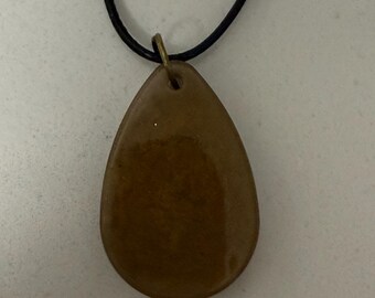 Pendant made with resin. Gold. Several different sizes and shapes. All 10” long.