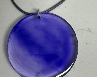 Pendant made with resin. Purple. Several different sizes and shapes. All 10” long.