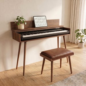 May include: A dark wood digital piano with a black keyboard and a tablet displaying sheet music on the stand. The piano features four tapered legs and is accompanied by a matching dark wood bench with a brown leather seat cushion.