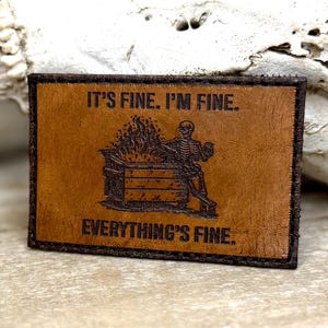 May include: A rustic wooden sign with the text "Welcome to our home" in white lettering. The sign features a distressed finish and a simple, inviting design, perfect for a front porch or entryway.