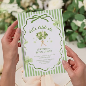 May include: A bridal shower invitation with a green and white striped background. The invitation features the text "Let's Celebrate" and details for the event, including the date, time, and location. The design includes shamrocks and a bouquet.
