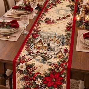 May include: A rectangular quilted table runner featuring a festive Christmas scene with a snowy village, a stone bridge, and Santa Claus in a sleigh pulled by reindeer. The border is deep red, decorated with poinsettia flowers, holly, and pinecones.