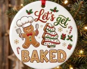 May include: A white ceramic Christmas ornament with a red ribbon. The ornament features a gingerbread man chef, a decorated gingerbread tree, and the text "Let's get BAKED" in festive lettering. Holly and snowflake accents complete the design.