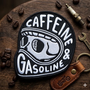 May include: Black and white embroidered patch with the words "Caffeine & Gasoline" and a skull design. The image also includes coffee beans, a spark plug, a wrench, and a leather keychain with a motorcycle graphic.