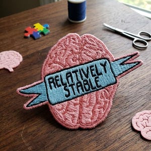 May include: A rustic wooden sign with the text "Welcome to our home" in white lettering. The sign features a distressed finish and a simple, inviting design, perfect for a front porch or entryway.